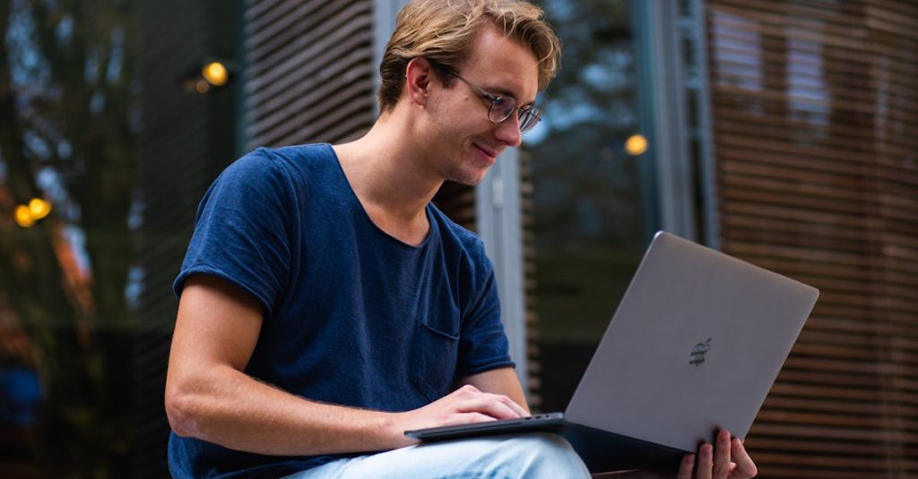 Selective Focus Photo of Man Using Laptop